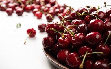 Organic food, vegan dieting and health concept - Fresh sweet cherries