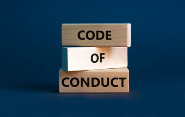 Code of conduct symbol. Concept words 'Code of conduct' on wooden blocks on a beautiful grey background. Business and code of conduct concept. Copy space.