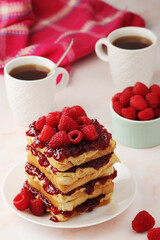 Sandwiches with peanut butter and raspberry jam