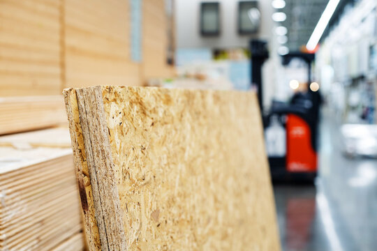 Sheets of OSB material in a hardware store on the background of a trading floor. Foreground. Selective focus