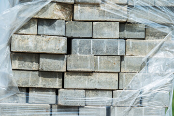 Paving stones in plastic packaging for paving streets and sidewalks. Close-up