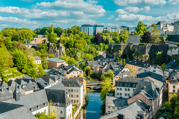 Fototapeta na wymiar Aerial panorama view of Luxembourg-City with Grund, Alzette river, and modern buildings in the background