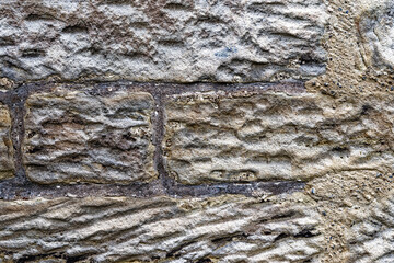 Texture of an old wall with different size stones