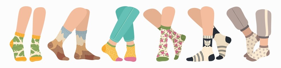 Legs in socks. Women and men wearing fashionable socks. Flat cartoon colorful sock with trendy pattern on feet, fashion accessories vector set. Clothing pieces, garment for winter season