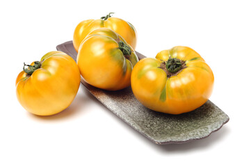 fresh yellow tomatoes on white background 