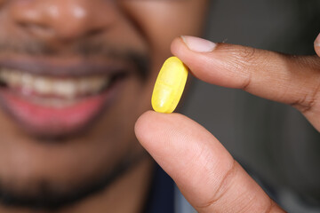 Close up of man hand holding pills