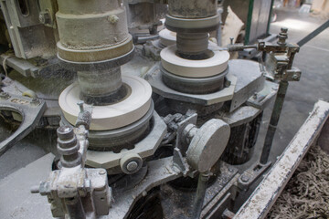 Metal rotating machine for making ceramic tableware from clay tableware close-up at a porcelain factory in Moscow region