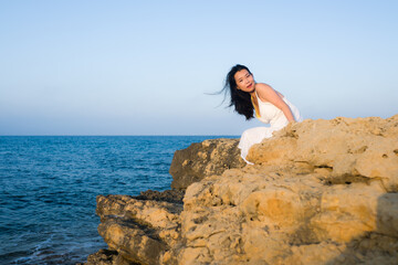 young happy and beautiful Asian woman by the sea - Attractive Korean girl cheerful enjoying relaxed summer holidays at tropical island in travel and lifestyle concept