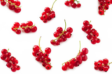 Red ripe brunch of currant on white background,top view. Berries pattern.