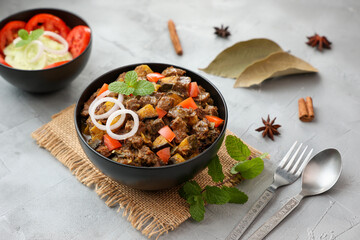 Spicy beef kaya curry beef fry South Indian Kerala India Sri Lanka. side dish Ghee rice, Appam, Parotta, Puttu. traditional Christian Muslim feast dish. Buffalo roast, meat pepper fry raw curry banana