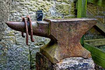 Beautiful vintage display with anvil and aged horseshoes