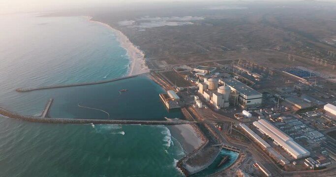 A nuclear power plant at South Africa Cape town coast line with beautiful blue ocean. Aerial view.