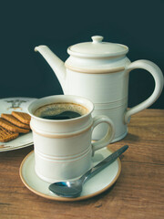 Cup of coffee and cookies on the table
