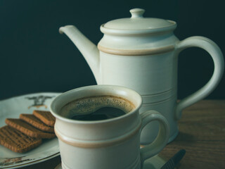 Cup of coffee and cookies on the table