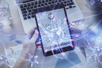 Double exposure of man's hands holding and using a phone and neuron drawing. Education concept.