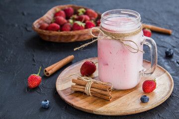 Healthy smoothie of fresh summer berries. Creative atmospheric decoration