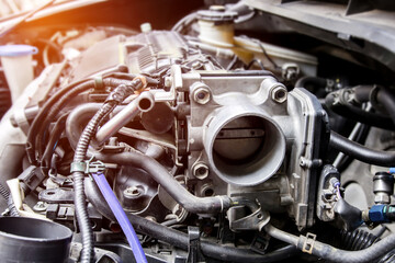 Close up old throttle Body of car in engine room with dust and Soot for repair and clean in process...