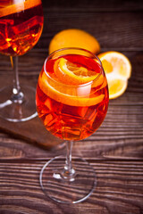 Aperol Spritz Italian cocktail alcoholic beverage with ice cubes and oranges.