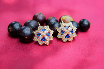 gold earrings on the leaves.Handmade red and black earrings. 