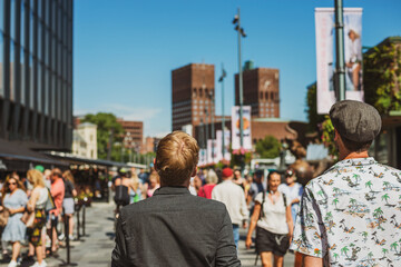 Summer holiday in Europe. People walking in central Oslo, Norway.