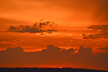 Fototapeta premium Red sunset with clouds in the evening