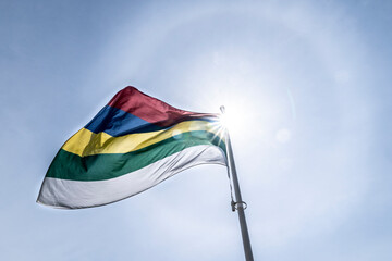 The Flag of Terschelling - one of the Wadden islands in The Netherlands - flying with the sun and a sun halo - an optical phenomenon