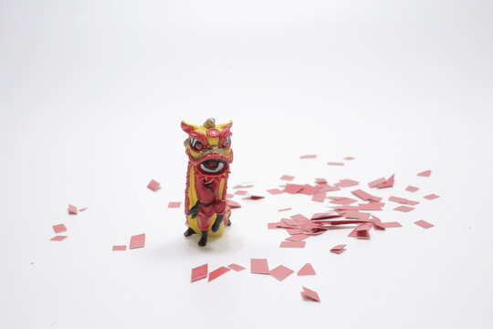 A Lion Dance And Confetti During Chinese New Year Celebration