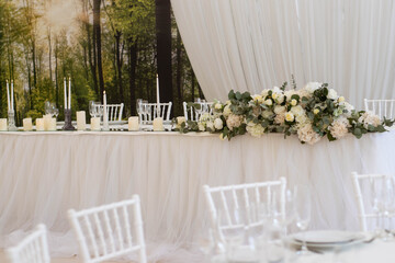 Main table at a wedding reception with beautiful white flowers