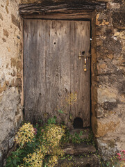 Details of an old door with stone frame in Provence, France
