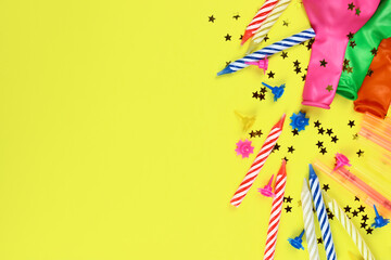 Festive background with birthday decor. Candles, balloons and confetti