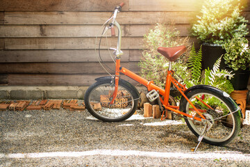 Fototapeta na wymiar Retro folding bike parked in front of the house