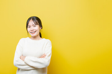 Obraz premium Photo of young attractive girl happy positive smile think hand touch chin isolated over yellow color background