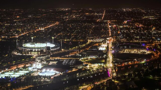 An aerial night time lapse of Melbourne City stadiums and sports grounds. CBD.