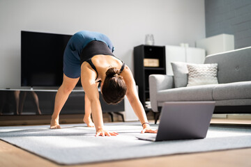 Fototapeta na wymiar Online Yoga Workout In Living Room. Women Classes