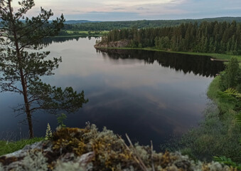landscape with a bay in the lake and sunset
