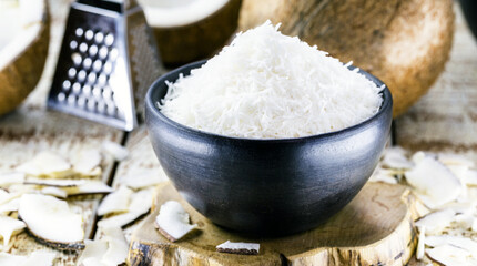 grated coconut, coconut shavings inside a clay bowl, cooking ingredient