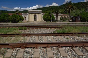 Fototapeta na wymiar Abkhazia. Tsandripsh. The station building from the side of the railroad bed.
