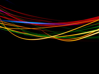 light painting photography, waves of vibrant color against a black background. Long exposure photo of vibrant fairy lights in abstract	
