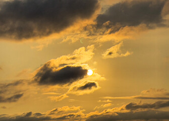 It contains the moon, the sun, and the clouds