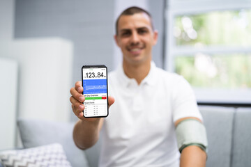 Blood Pressure Check Using Smart Monitor - obrazy, fototapety, plakaty