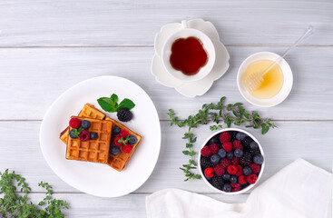 Viennese waffles, with berries, on a white table, breakfast, no people, horizontal, top view, 