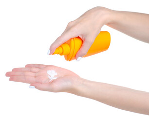 Suntan lotion cream bottle in hand on white background isolation