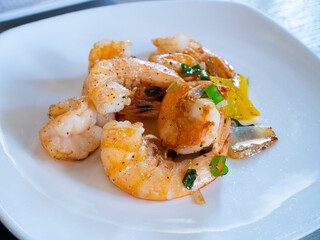 Plate of cooked shrimp. Salt and pepper shrimp.