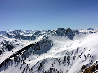 Winter snow covered mountain peaks in Austrian alps. 