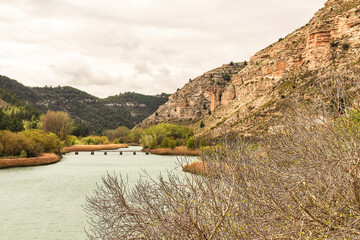 Fototapeta premium Tolosa reservoir surrounded by vegetation and mountains