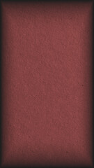 The surface of dark brown cardboard. Paper texture with cellulose fibers. Paperboard mobile phone wallpaper with vignetting. Textured narrow vertical background or backdrop. Macro