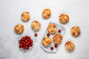 Homemade muffins with sweet red cherries.