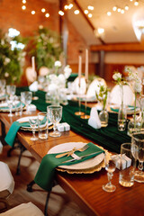 Wedding. Banquet. Beautiful table setting for a party, wedding reception or other festive event emerald colour.