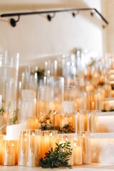 Romantic Wedding Table Top Layout Decor with large lush floral bouquets including white roses, ranunculus, persian buttercups, white orchids and candles