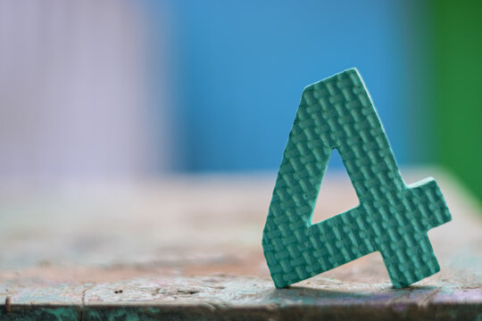 A digit 4 placed in a wooden surface
